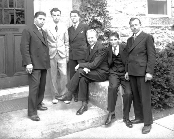 Five men from the Soviet Union at Adams Hall, and John Merkel, the foreign student advisor at the U.W., second from the left. Engineering students.