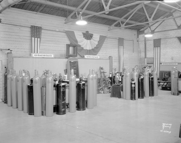 Air Reduction Sales Co. display of oxygen and acetylene tanks at the 2nd welding conference in the U.W. engineering building.