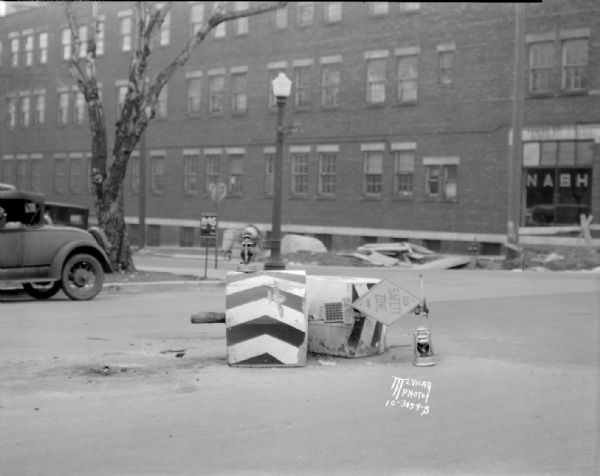 Wrecked pedestrian safety island, University Avenue and Francis Street, struck by the Rev. George E. Hunt.