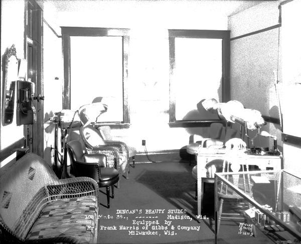 Interior of Duncan's Beauty Studio, 105 State Street, featuring dryers and chairs.