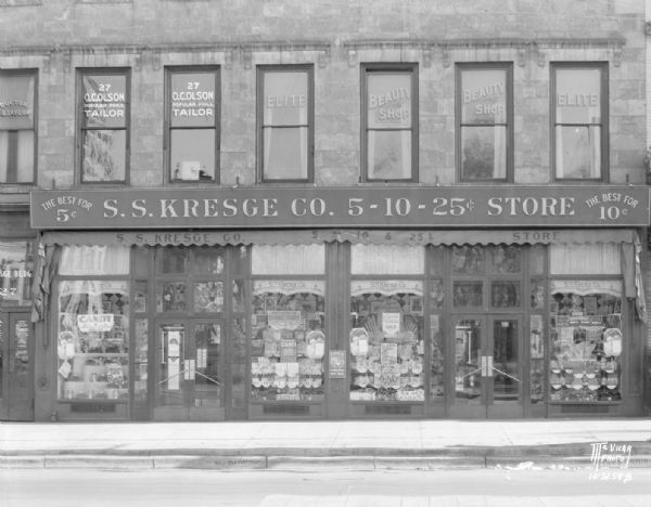 Storefront of S.S. Kresge variety store, 25 E. Main Street. Also shows second floor business windows for a tailor and a beauty shop.