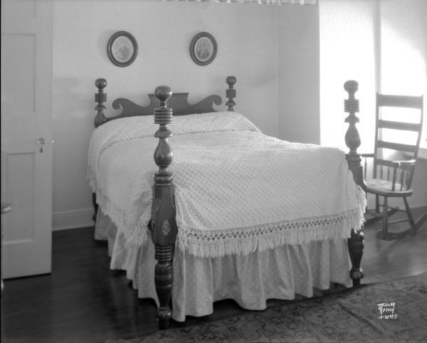 Bedroom of Mrs. Walter H. Sheldon residence, showing 4 poster bed and hobnail chenille bedspread.