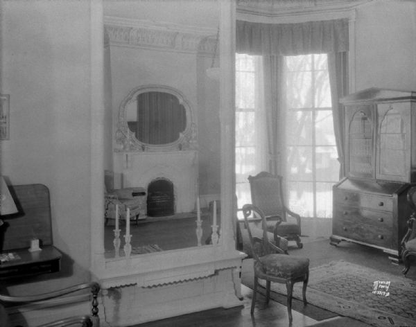 Drawing room at Governor's Residence showing large oval mirror over the left fireplace, 130 East Gilman Street.