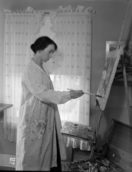 Helen Wann Annen (Mrs. P.J. Annen) painting in studio at 2321 Rugby Row.