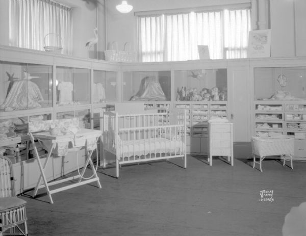 Manchester's baby department showing baby furniture, toys, and clothes.