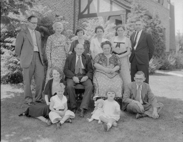 Group portrait of the Ketchum family posing outdoors.