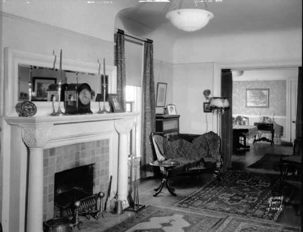 William and Ruth Page's living room with fireplace and view of dining room, 515 N. Carroll Street.