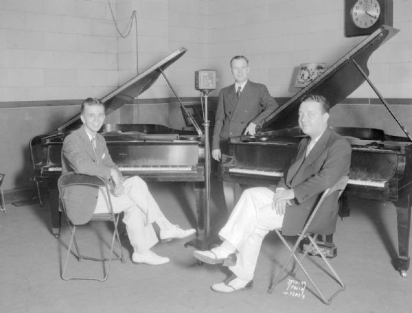 Buckman Musicale Artists, from l to r; Dave Welton, pianist; Francis Slightam, tenor soloist; and James Donahue, pianist, posing at WIBA studio.
