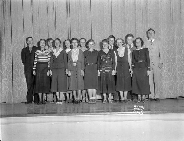 Group portrait of West High school play cast.