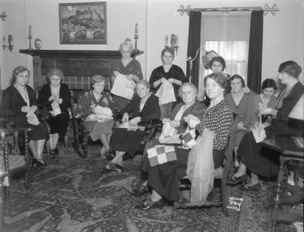 Large group of women sewing for the Red Cross in the home of James and Mary McManamy, 2005 Jefferson.