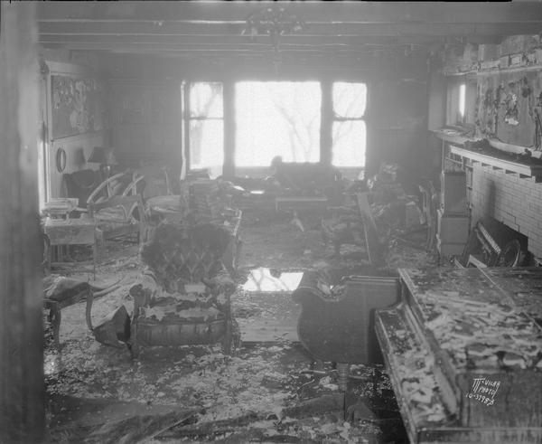 Chandler B. and Frances Chapman home, 640 N. Carroll Street, showing the living room from the hall after the fire.