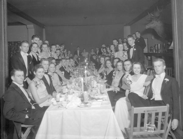 Chi Psi fraternity pre prom dinner at Chi Psi house, 105 Iota Court, with Prom King and Queen.