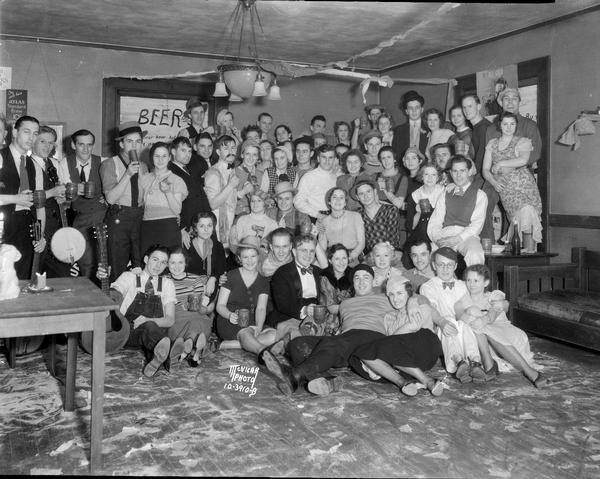Group portrait of students in costume at the Triangle Fraternity bowery party, 438 N. Frances Street.