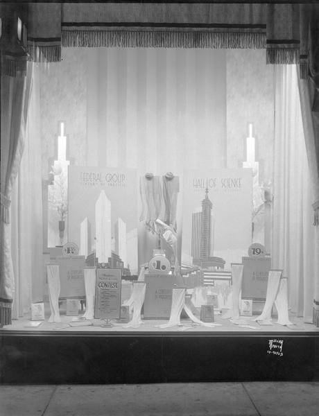 Manchester's window display featuring Phoenix Hosiery manufactured at the Chicago Century of Progress World's Fair and featured as prizes in a contest. Century of Progress buildings pictured in background.