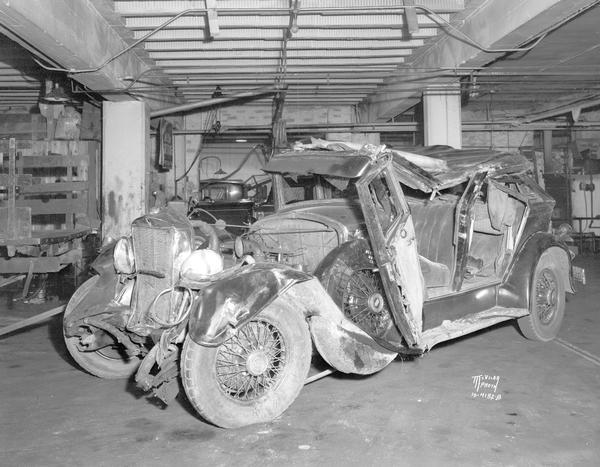 Damaged automobile owned by Harry E. McElroy at Koch Motors, 317 W. Johnson Street. It was involved in accident on East Washington Avenue on August 20th.
