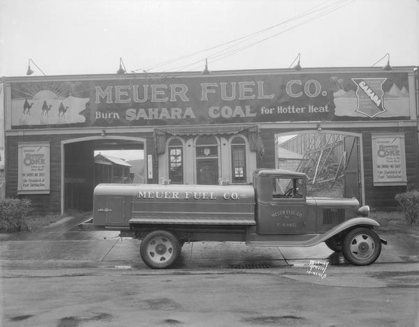 Meuer Fuel Co., 124-128 N. Bedford Street, Chevrolet oil truck. Signage reads: "Burn Sahara Coal for Hotter Heat."