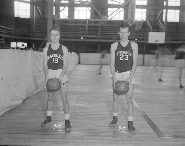Portrait of two University of Wisconsin-Madison basketball players in uniform.