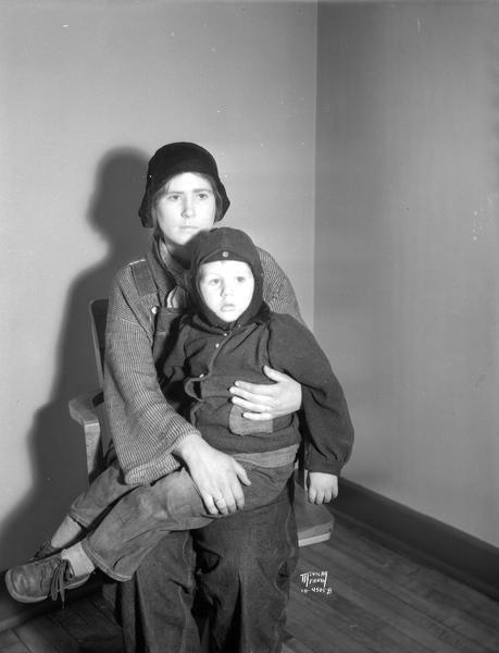 Doris LeBundy and her son Norman Lee Johnson at Police Station after being picked up for hitching a ride on a railroad car.