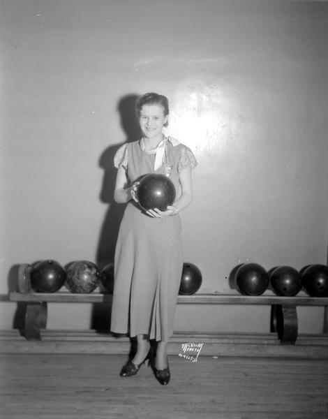 Verona Langedyk holding a bowling ball at Madison Palm Garden and Bowling Alleys. Langedyk was a record setter at the Women's City Bowling Tournament.