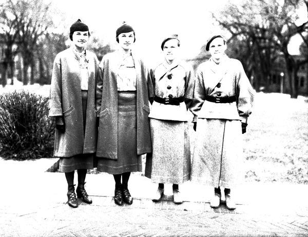 Outdoor portrait of two pairs of twins at University of Wisconsin. Left to right: Mary and Elizabeth Rhodes and Eleanor and Dorothea Bond. 