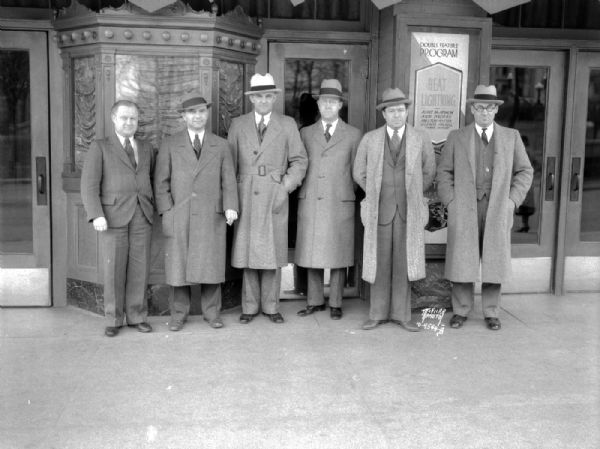 To acquaint Madison with the horrors of World War I the American Legion was bringing the film "Hell's Holiday" to the Parkway Theater. Left to right: Lane Ward, Manager American Legion Band; Dr. R.E. Mutchler, Commander Cairns Post; Leo Blied, Past Commander;  E.D. Hatfield, Publicity Chairman; Ben Bull, Vice Commander; Fred Evans, Committee Chairman.