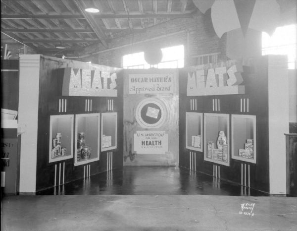 Oscar Mayer meat exhibit at the Madison Home Show featuring canned meat products. Sign reads: "Oscar Mayer's approved brand," "U.S. Inspection for your health protection."