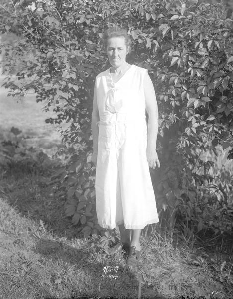 Outdoor portrait of Nettie Livingston, 1205 Vilas Avenue, who works as a maid at Wisconsin General Hospital, hopes to win a vacation at the Bowman House, a haven for working women over 45, in the Wisconsin Dells.