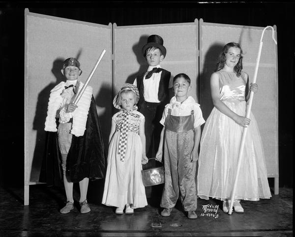 Howard Hoesly, Nancy Truog, Winston Sala, Arlene Herrick, Tim Harrington dressed as Mother Goose characters for the Kiddie Kamp Koncert at the Madison Woman's Club building, 240 W. Gilman Street.