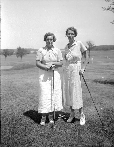 Mary Callahan, Nakoma on the left, and Dorothy Page, Madison on the right, leaders in the qualifying round of the Wisconsin women's golf association tournament.