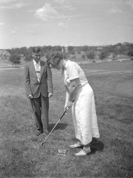 Herb Spaanum, Monona golf pro, coaching Marian Callahan.
