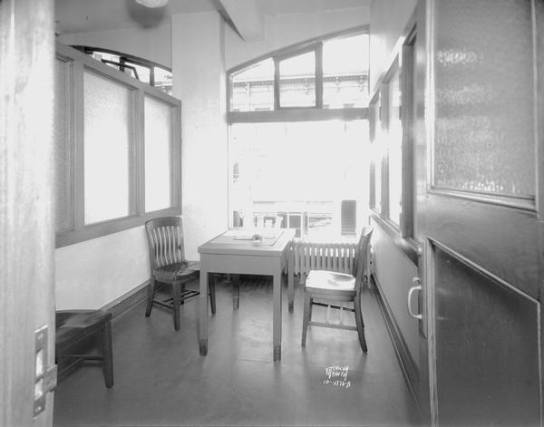 Wisconsin State Employment Service, 111 King Street, employers' interview room, table and chairs.