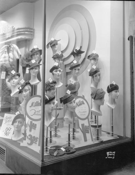 Miller's Inc. Women's Apparel, 23 E. Main Street, hat display window "Featuring the most popular millinery styles."
