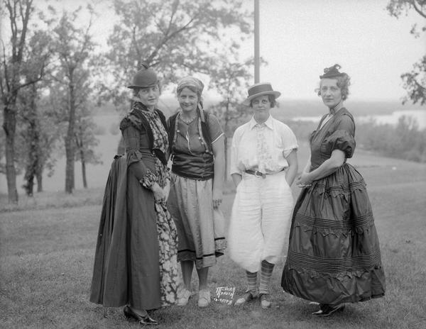 Four women in costume at Blackhawk Country Club for "Costume Golf Day."