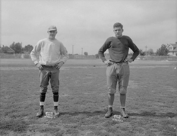 Two East High football players. 4823B-1 (Unknown). 4823B-2  (Unknown).