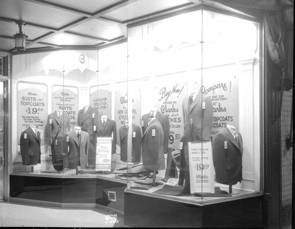 Clarks, 126 State Street, right hand window display of men's suits.