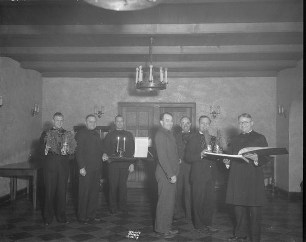 Seven men preparing for the burning of the second mortgage, Nakoma Country Club. It became the Nakoma Golf Club in 1944.