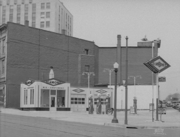 Diamond Service Station, 118 King Street (Mid-Continent Petroleum Corp) looking toward South Butler Street, with partial view of Tenney Building.