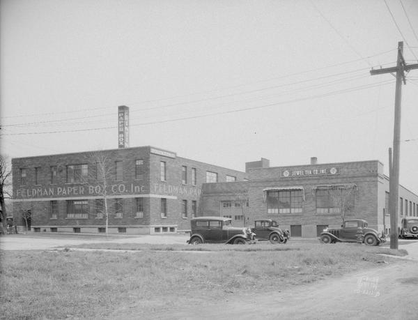 South side of Feldman Paper Box Co., 29 N. Charter Street and Jewel Tea Co. warehouse, 31 N. Charter Street. Four automobiles are on the street.