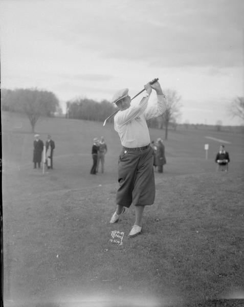 Francis Gallet, Blue Mound professional golfer, Milwaukee, posing in golf swing.