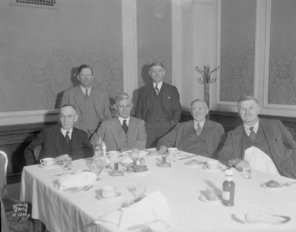 William T. Evjue with five former members of the Wisconsin Legislature. Left to right they are: Charles Beggs, Barron Co.; John Johnson, Fond du Lac Co.; Charles D. Ross, Rock Co.; Evjue (editor of the Madison Capital Times); J.C. Hanson, Dane Co.; and P.A. Hemmy, Jackson Co. They were supporters of Robert La Follette, Sr. when the 1917 State Legislature attempted to censure him for his opposition to U.S. entry into World War I. Text on negative sleeve reads: "War Time Legislators Group."