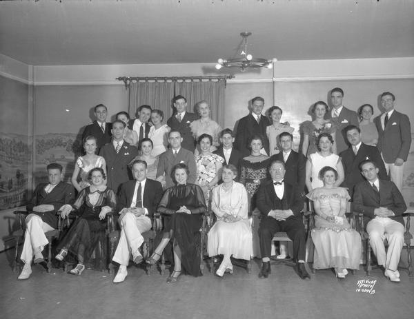 Group portrait of Tau Epsilon Rho, Jewish Law School honorary fraternity, and dates at formal in the Old Madison Room, Memorial Union.