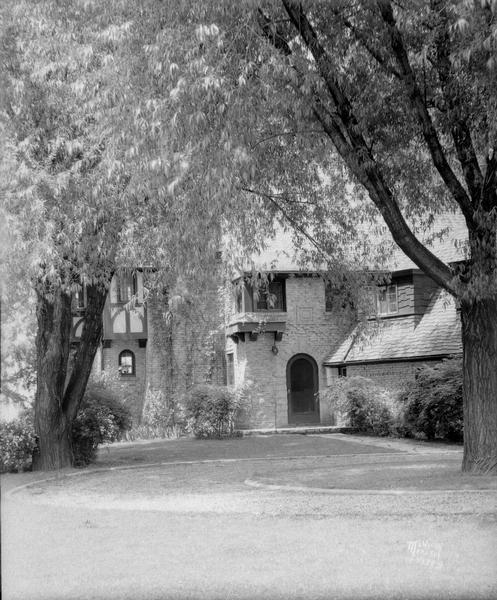 Howard Beck house, 33 Cambridge Road, Lakeview subdivision. Close-up of front entrance and trees.