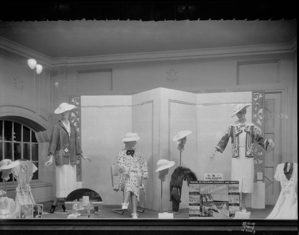 Kessenich's, 201-203 State Street, Railroad week window. Mannequins in clothes for travel. Sign reads: "Travel in Pullman comfort and safety."