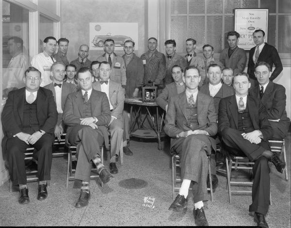 Group portrait of Kayser Motors salesmen and mechanics, 701 E Washington Street.