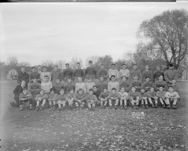 Outdoor group portrait of the Central High School football team in uniform.