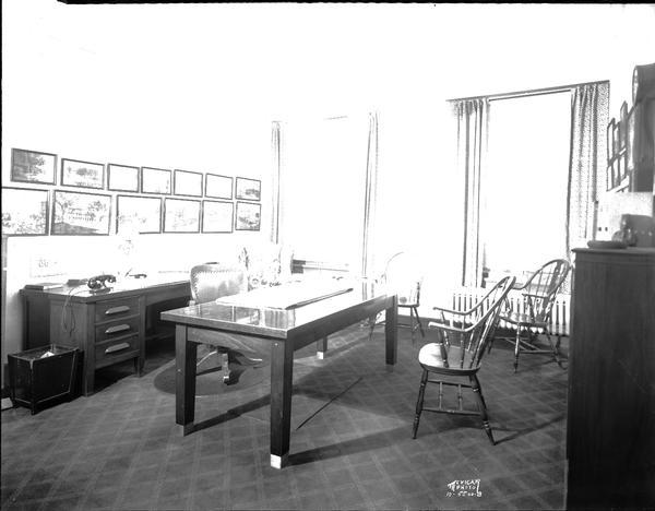 Stanley Hanks private office, 24 W. Mifflin Street, with historic Madison photographs on the wall. Hanks & Bush, Inc. Insurance.