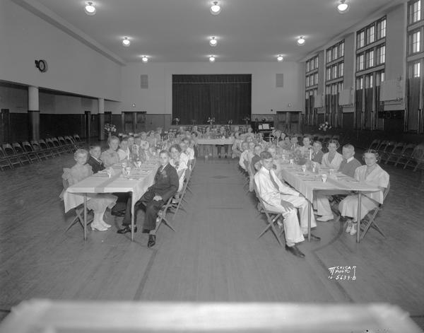 Children are sitting at the eighth banquet tables at the Franklin School, 305 W. Lakeside Street. There are a few adults sitting at the head table in the background.
