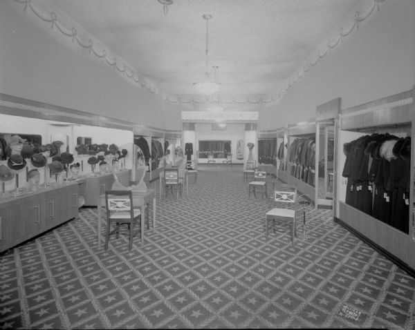 Darling Shop, 9 E. Main Street, interior, showing women's coats and hats.