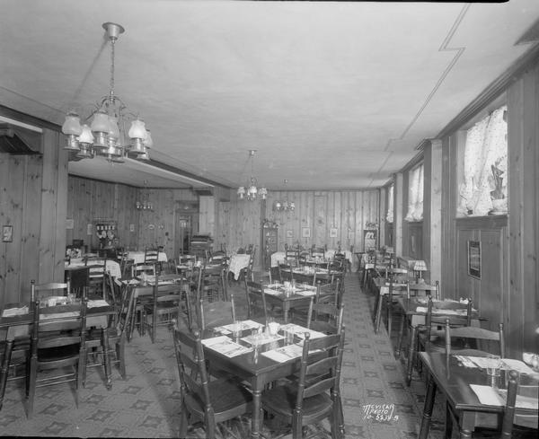 Kennedy Manor dining room, 1 Langdon Street, showing tables and chairs and piano.