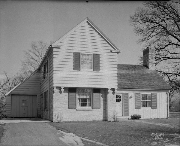 Eugene and Beth Coombs house, 212 Lakewood Boulevard, Lakewood, showing attached garage.